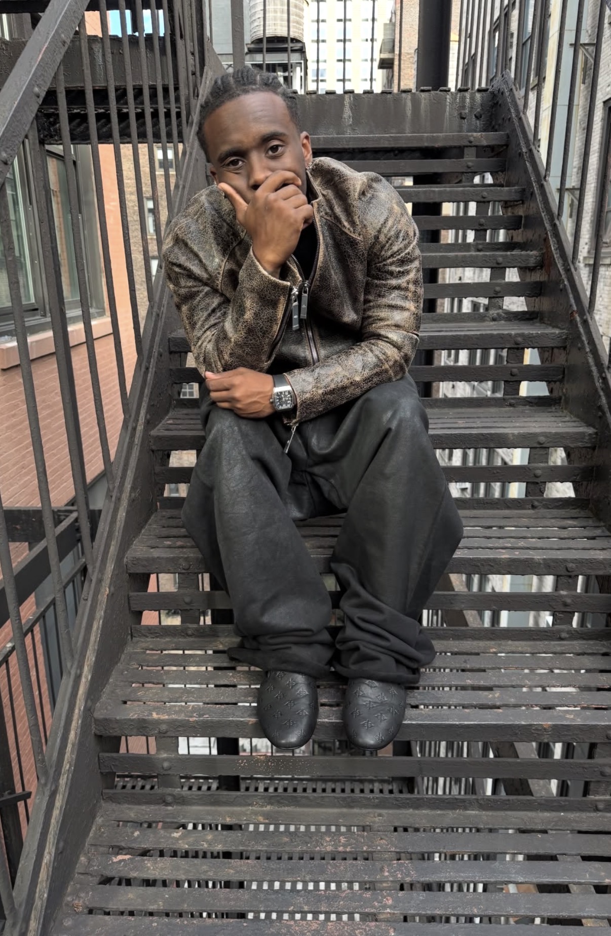 Kai Cenat wearing Vivet on a New York fire escape, shared on Instagram