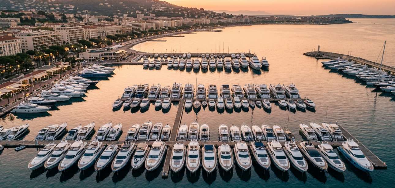 Luxury yachts moored at a French Riviera yacht show at golden hour