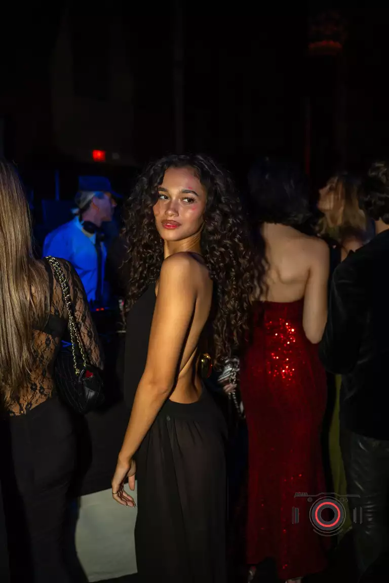 Two guests pose outside Casa Cipriani during Drake’s birthday celebration.