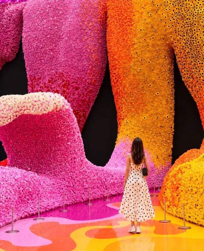Visitor facing tall pink, orange and purple LEGO botanical cascades