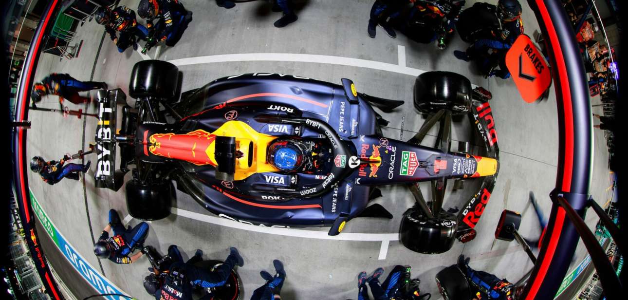 Overhead view of an Oracle Red Bull Racing car surrounded by pit crew