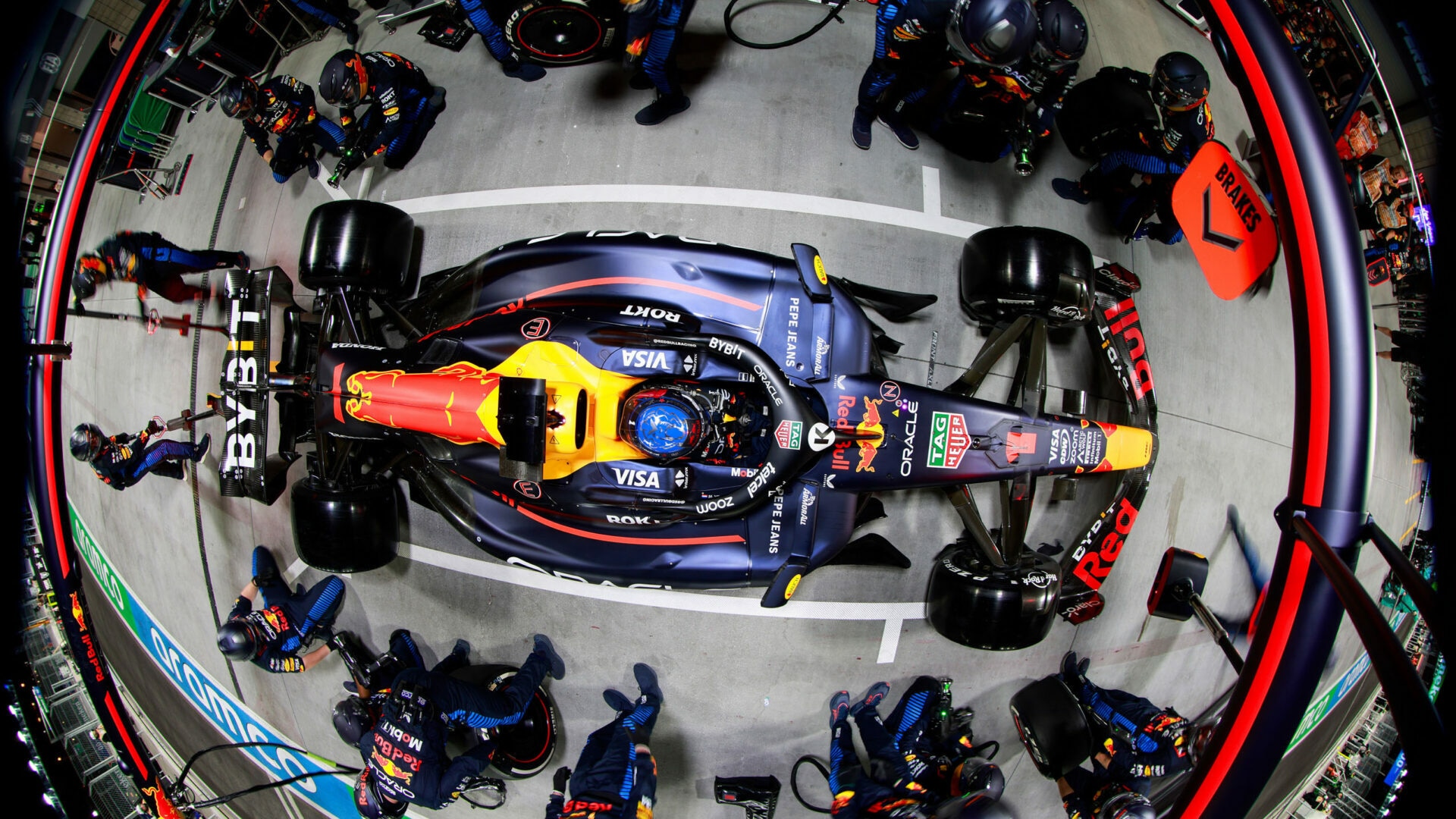 Overhead view of an Oracle Red Bull Racing car surrounded by pit crew
