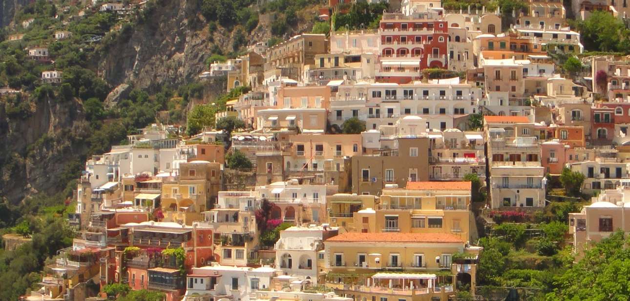 Colorful Positano homes descend the hillside toward the Amalfi Coast.