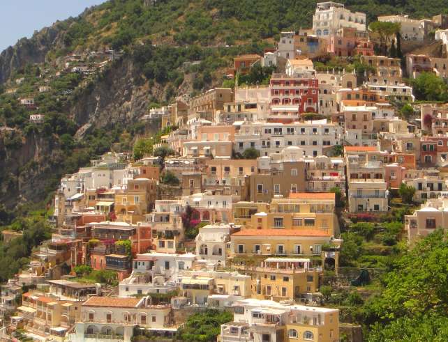 Colorful Positano homes descend the hillside toward the Amalfi Coast.