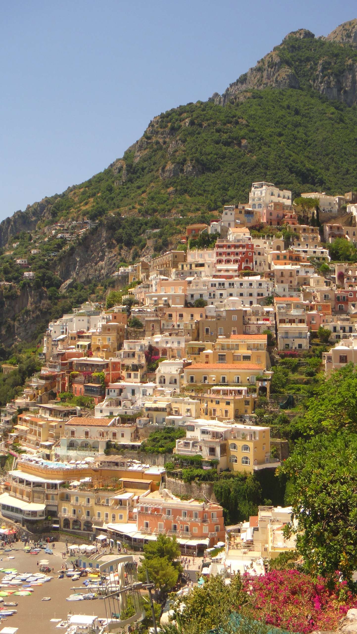 Colorful Positano homes descend the hillside toward the Amalfi Coast.