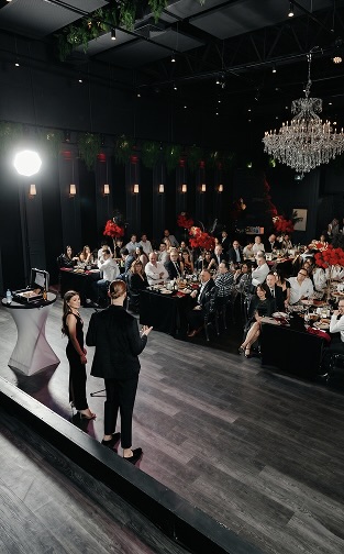 Roman Royss performing for guests at a gala